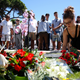 People lay flowers in tribute to the victims of the Nice attack.